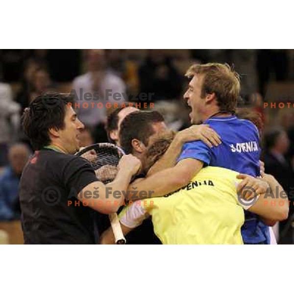 Coach Ziga Janskovec, Blaz Kavcic, Luka Gregorc, Grega Zemlja, Captain Blaz Trupej and players and staff of Slovenia celebrate victory 3:2 in Davis Cup match Slovenia- Finland, played in Hala Tivoli, Ljubljana, Slovenia on March 6, 2011 