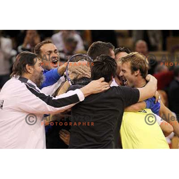 Coach Ziga Janskovec, Blaz Kavcic, Luka Gregorc, Grega Zemlja, Captain Blaz Trupej and players and staff of Slovenia celebrate victory 3:2 in Davis Cup match Slovenia- Finland, played in Hala Tivoli, Ljubljana, Slovenia on March 6, 2011 