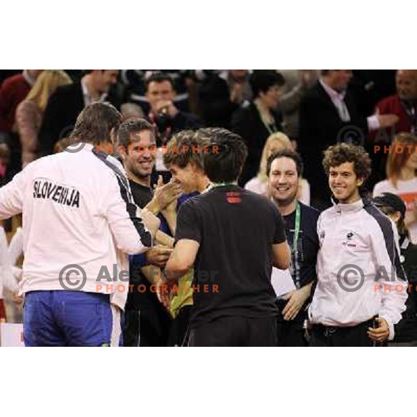Coach Ziga Janskovec, Blaz Kavcic, Luka Gregorc, Grega Zemlja, Captain Blaz Trupej and players and staff of Slovenia celebrate victory 3:2 in Davis Cup match Slovenia- Finland, played in Hala Tivoli, Ljubljana, Slovenia on March 6, 2011 