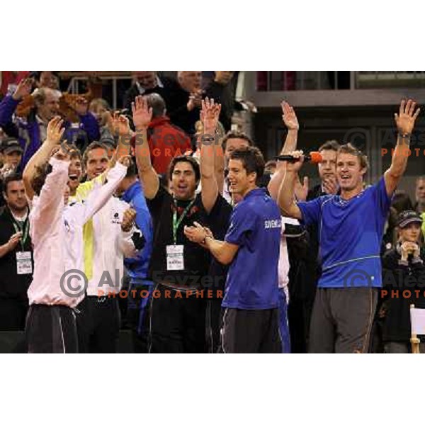 Coach Ziga Janskovec, Blaz Kavcic, Luka Gregorc, Grega Zemlja, Captain Blaz Trupej and players and staff of Slovenia celebrate victory 3:2 in Davis Cup match Slovenia- Finland, played in Hala Tivoli, Ljubljana, Slovenia on March 6, 2011 