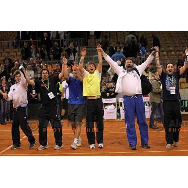 Coach Ziga Janskovec, Blaz Kavcic, Luka Gregorc, Grega Zemlja, Captain Blaz Trupej and players and staff of Slovenia celebrate victory 3:2 in Davis Cup match Slovenia- Finland, played in Hala Tivoli, Ljubljana, Slovenia on March 6, 2011 