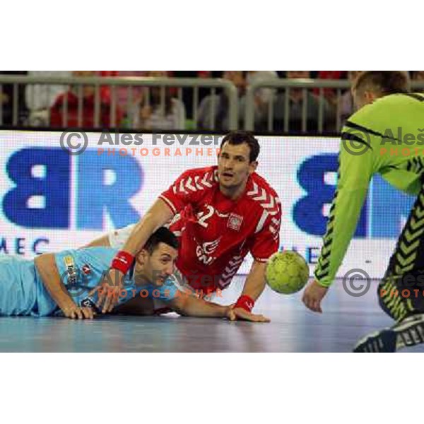 Dragan Gajic of Slovenia and Marcin Lijewski of Poland in action during handball match Slovenia-Poland in first leg of qualification for EHF Handball Euro 2012, played in front of 12.000 spectators in Stozice, Ljubljana, Slovenia on march 9, 2011 