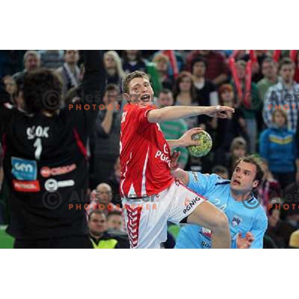  Orzechowski of Poand and Uros Zorman of Slovenia in action during handball match Slovenia-Poland in first leg of qualification for EHF Handball Euro 2012, played in front of 12.000 spectators in Stozice, Ljubljana, Slovenia on march 9, 2011 