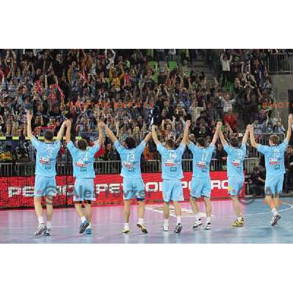 Uros Zorman, Matevz Skok, Dragan Gajic and players of Slovenia celebrate victory after handball match Slovenia-Poland in first leg of qualification for EHF Handball Euro 2012, played in front of 12.000 spectators in Stozice, Ljubljana, Slovenia on march 9