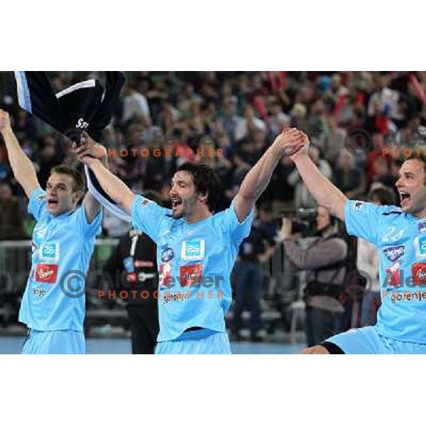 Matjaz Brumen, David Spiler and Uros Zorman of Slovenia celebrate victory after handball match Slovenia-Poland in first leg of qualification for EHF Handball Euro 2012, played in front of 12.000 spectators in Stozice, Ljubljana, Slovenia on march 9, 2011 
