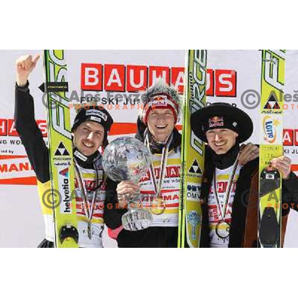 Simon Ammann (SUI) Thomas Morgenstern (AUT) and Adam Malysz (POL) on podium of FIS World Cup Ski Jumping Overall standings for season 2010-2011 during Final in Planica, Slovenia on March 20, 2011 