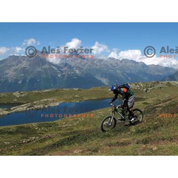 Ales Fevzer having a great time while riding MTB downhill tracks in Alpe d\'Huez ski resort at altitude between 1800 and 2700 meters above sea level on August 1, 2011 