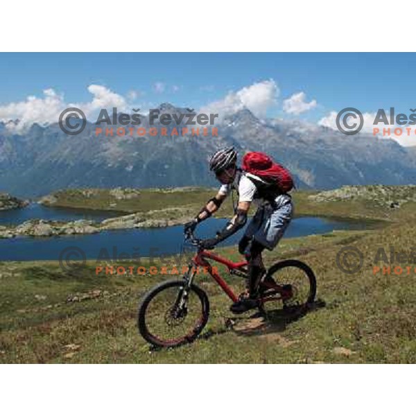 Tit Kosir having a great time while riding MTB downhill tracks in Alpe d\'Huez ski resort at altitude between 1800 and 2700 meters above sea level on August 1, 2011 