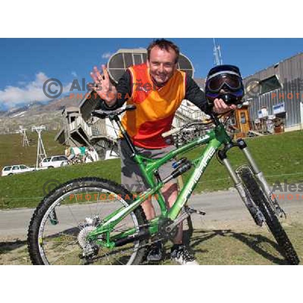 Ales Fevzer having a great time while riding MTB downhill tracks in Alpe d\'Huez ski resort at altitude between 1800 and 2700 meters above sea level on August 1, 2011 
