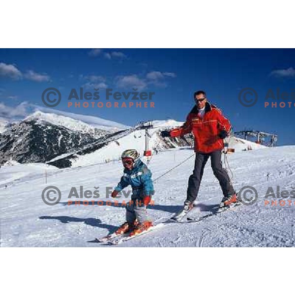 Teaching child to ski at Krvavec ski resort