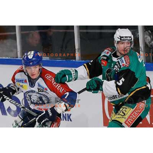 Andrew Thomas of Telemach Olimpija and Adam Naglich of KHL Medvescak Zagreb in action during Icefest 2013 open-air hockey match played on Joze Plecnik Bezigrad stadion in Ljubljana, Slovenia on January 6th, 2013 