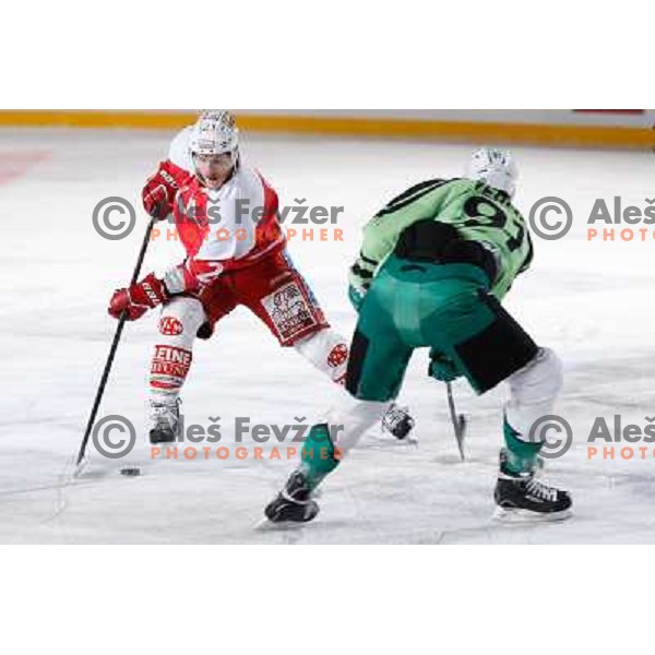 Manuel Geier of KAC Celovec and Miha Verlic of Telemach Olimpija in action during Icefest 2013 open-air hockey match played on Joze Plecnik Bezigrad stadion in Ljubljana, Slovenia on January 8th, 2013 