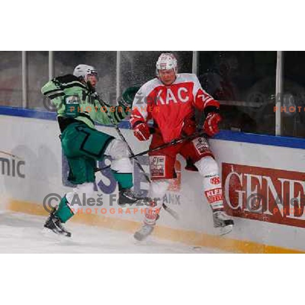 Ziga Pance of Telemach Olimpija and Michael Siklenka of KAC Celovec in action during Icefest 2013 open-air hockey match played on Joze Plecnik Bezigrad stadion in Ljubljana, Slovenia on January 8th, 2013 