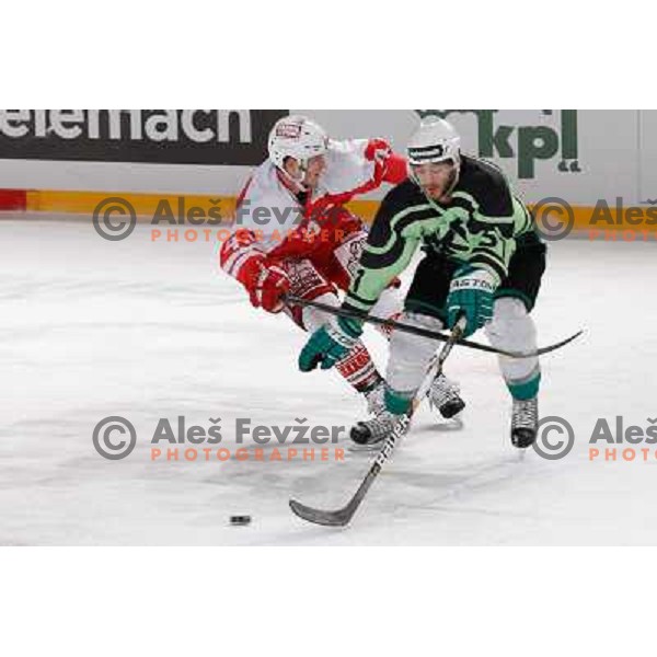 Kevin DeVergilio of Telemach Olimpija and Markus Pirmann of KAC Celovec in action during Icefest 2013 open-air hockey match played on Joze Plecnik Bezigrad stadion in Ljubljana, Slovenia on January 8th, 2013 