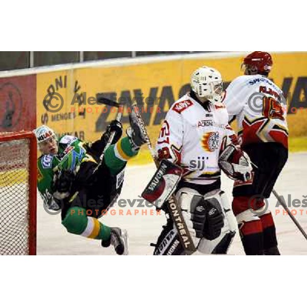 Blaz Klinar (15) sacks Ales Music (16) at ice hockey match ZM Olimpija-Acroni Jesenice in Hala Tivoli, Ljubljana. ZM Olimpija won the match 4:3.