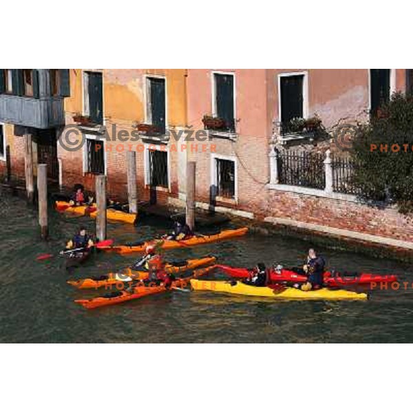 Exploring city of Venice with sea kayaks during 2007 Carnival on Saint Mark Square.