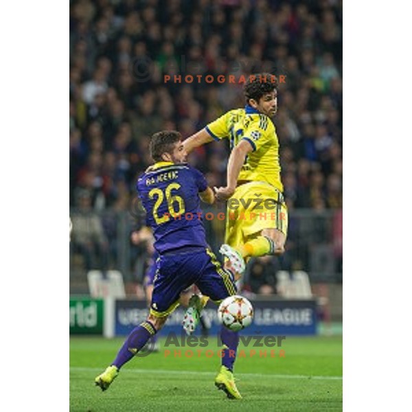 Aleksander Rajcevic and Diego Costa in action during football match Maribor - Chelsea in UEFA Champions League, played in Ljudski Vrt , Maribor, Slovenia on November 5,.2014