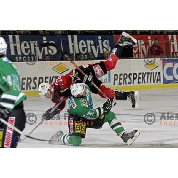 Healey (16) flying over Corupe (51) at ice-hockey match ZM Olimpija-Acroni Jesenice in 22nd round of Ebel league,played in LJUBLJANA (Slovenia) 18.11.2007. ZM Olimpija won 5:4 after shot-out. Photo by Ales Fevzer 