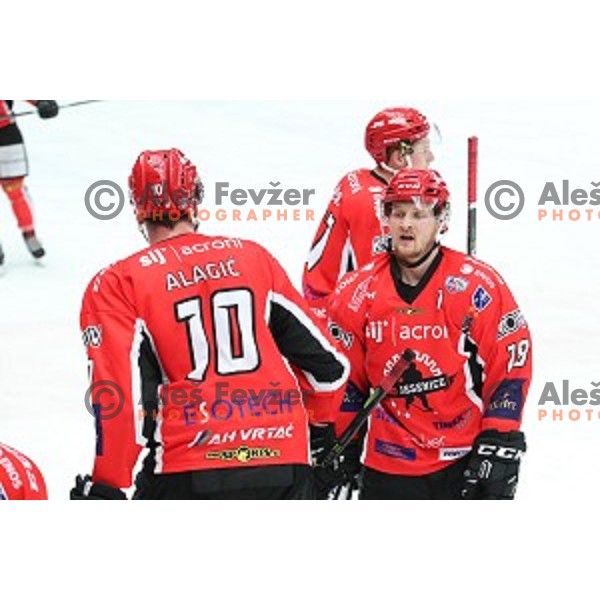 Adis Alagic and Markus Piispanen in action during Alps League ice-hockey match between SIJ Acroni Jesenice and SZ Olimpija in Podmezakla Hall, Jesenice, Slovenia on December 30, 2017