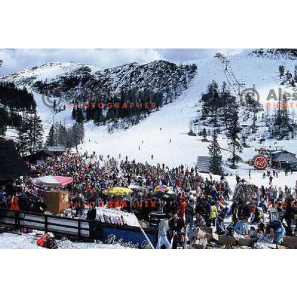 Krvavec ski resort, popular Plaza (the beach) full of skiers in early spring 