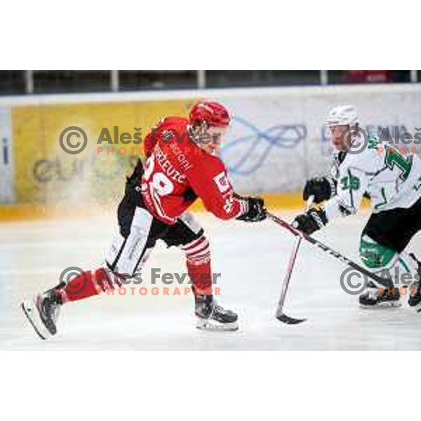 Blaz Tomazevic and Ales Music in action during Alps league ice-hockey match between Acroni Jesenice and SZ Olimpija in Podmezakla Hall, Jesenice, Slovenia on March 2, 2020