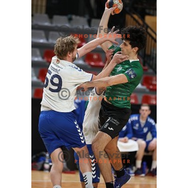 Miha Tomsic blocks Arsenije Dragasevic during 1.NLB league handball match between MRK Ljubljana and Celje Pivovarna Lasko in Kodeljevo Hall, Ljubljana, Slovenia on December 12, 2020