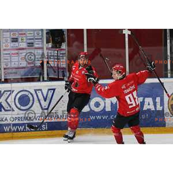 Zan Jezovsek and Blaz Tomazevic in action during Alps league ice-hockey match between Acroni Jesenice and SZ Olimpija in Jesenice, Slovenia on March 9, 2021
