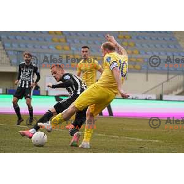 Tomi Horvat and Senijad Ibrcic in action during Prva Liga Telekom Slovenije 2020-2021 football match between Domzale and Mura in Domzale, Slovenia on March 10, 2021