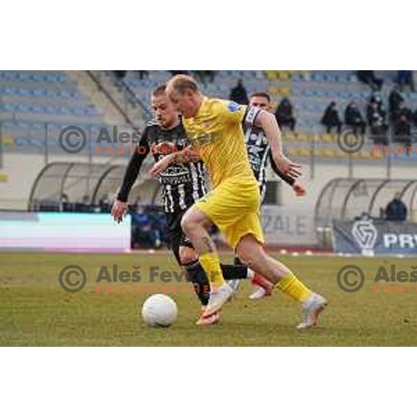 Tomi Horvat and Senijad Ibrcic in action during Prva Liga Telekom Slovenije 2020-2021 football match between Domzale and Mura in Domzale, Slovenia on March 10, 2021