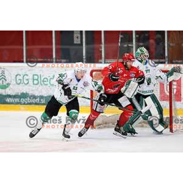 Jusso Puuli, Gasper Glavic and Paavo Holsa in action during second game of the Final of Slovenian Championship ice-hockey match between SIJ Acroni Jesenice and SZ Olimpija in Jesenice, Slovenia on May 3, 2021