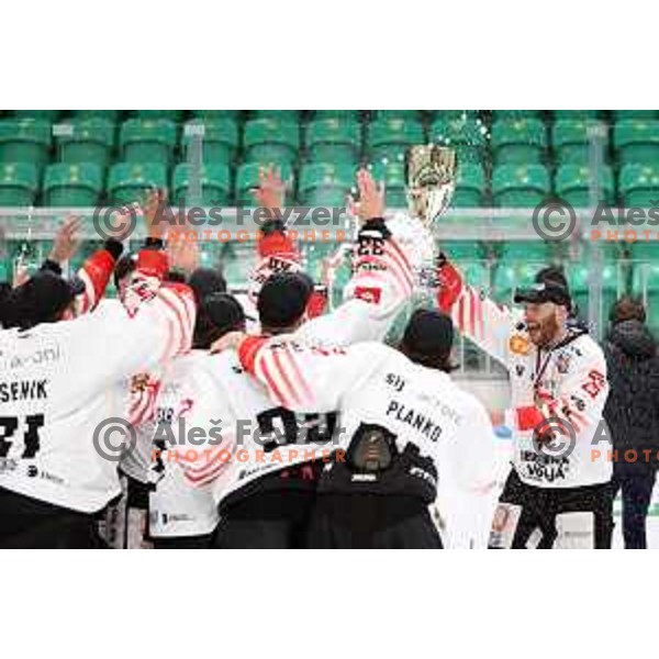 Andrej Tavzelj and players of SIJ Acroni Jesenice celebrate Slovenian Championship ice-hockey title after victory in fifth match v of the Final between SZ Olimpija and SIJ Acroni Jesenice in Ljubljana, Slovenia on May 10, 2021
