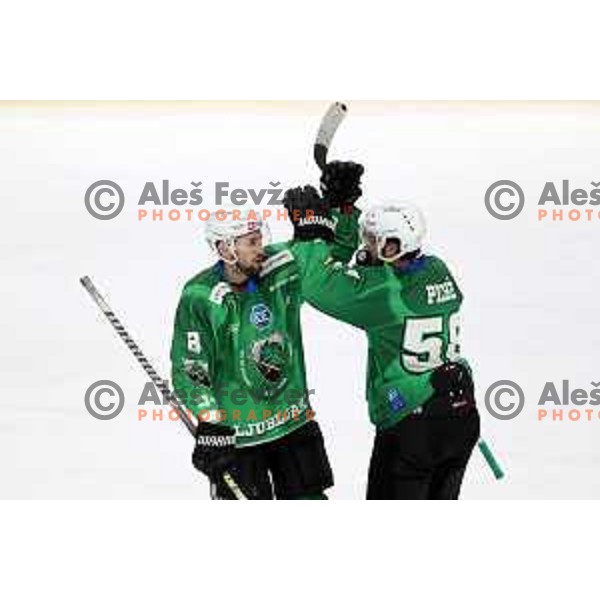 Daniel Wade Murphy and Sebastien Piche of SZ Olimpija celebrate goal during IceHL match between SZ Olimpija and Vienna Capitals in Ljubljana, Slovenia on January 21, 2022