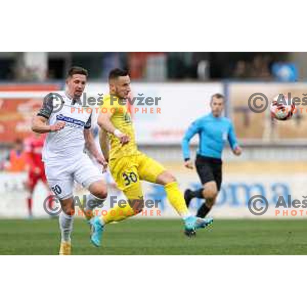Luka Susnjara and Enes Alic in action during Prva Liga Telemach 2021-2022 football match between Domzale and Koper in Domzale, Slovenia on April 16, 2022