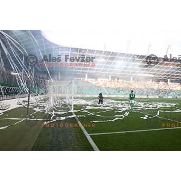 Ivan Prtajin collects paper stripes on the pitch during Prva Liga Telemach football match between Olimpija and Mura in SRC Stozice, Ljubljana, Slovenia on May 15, 2022