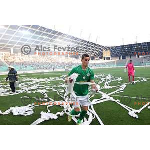 Ivan Prtajin collects paper stripes on the pitch during Prva Liga Telemach football match between Olimpija and Mura in SRC Stozice, Ljubljana, Slovenia on May 15, 2022