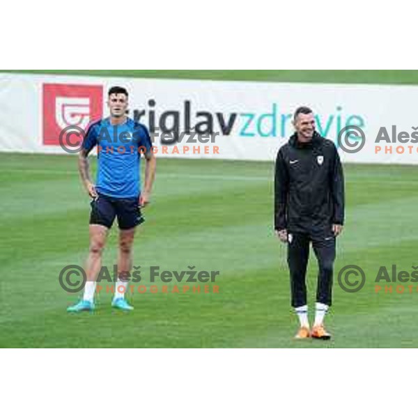 Benjamin Sesko and Milivoje Novakovic, assistant coach of Slovenia Football team during practice session at NNC Brdo on May 30, 2022