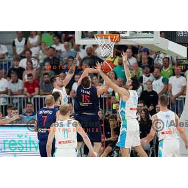 Luka Doncic, Nikola Jokic and Mike Tobey in action during Telemach match between Slovenia and Serbia in SRC Stozice, Ljubljana, Slovenia on August 17, 2022