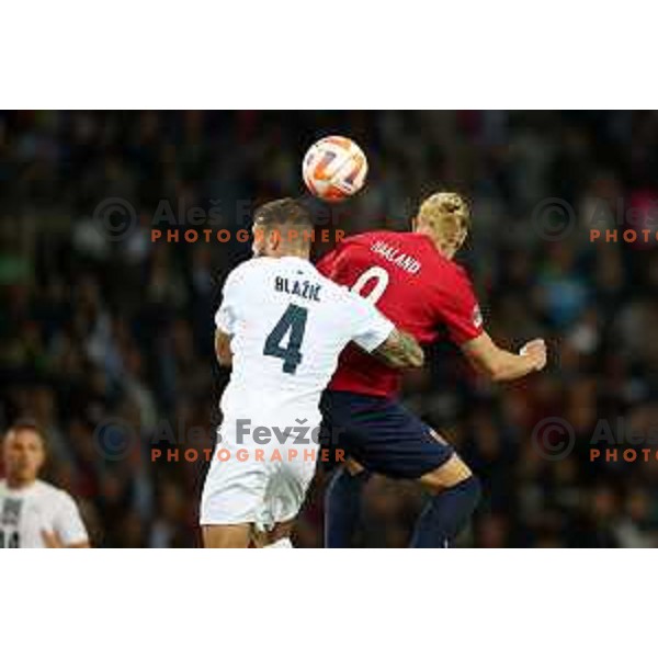 Miha Blazic and Erling Haaland in action during UEFA Nations League match between Slovenia and Norway in Stozice, Ljubljana, Slovenia on September 24, 2022