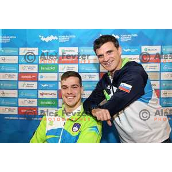 Peter John Stevens and Luka Berdajs, coach of Slovenia Swimming team at press conference in Ljubljana, Slovenia on November 28, 2022 