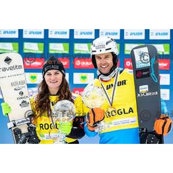 Ramona Hofmeister and Roland Fischnaller, winners of FIS Snowboard World Cup Parallel Giant Slalom at Rogla Ski resort, Slovenia on March 15, 2023
