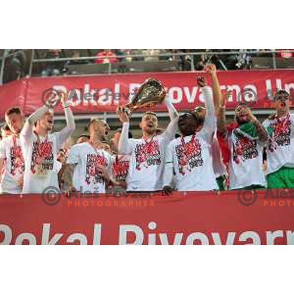 Timi Max Elsnik, head coach Albert Riera and players of Olimpija celebrate victory at Pivovarna Union Slovenian Cup match between Olimpija and Maribor in Celje on May 6, 2023