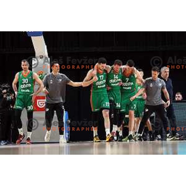 Karlo Matkovic and Amar Alibegovic are taking injured Josh Adams from the court during the third match of the quarter-final of the ABA league between Cedevita Olimpija and FMP in Ljubljana, Slovenia on May 13, 2023