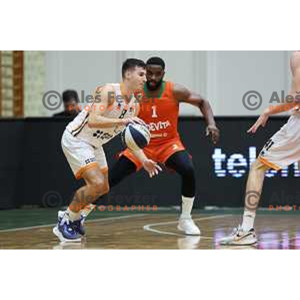 Rok Nemanic and Sean Armand in action during Slovenian SuperCup basketball match between Cedevita Olimpija and Kansai Helios Domzale in Kranj, Slovenia on September 25, 2023