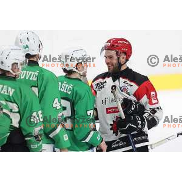 Bine Masic and Zan Jezovsek in action during the Slovenian Championships 2023/2024 ice-hockey match between SZ Olimpija and SIJ Acroni Jesenice in Ljubljana, Slovenia on January 30, 2024