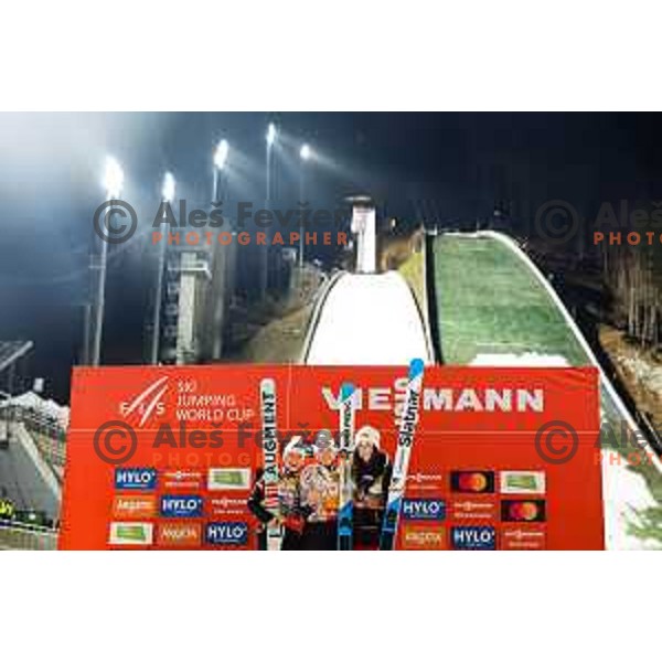 Eva Pinkelnig of Austria, Nika Prevc of Slovenia and Alexandria Loutitt of Canada in action during trophy ceremony after the final round of FIS Ski Jumping competition in Planica, Slovenia on March 21, 2024
