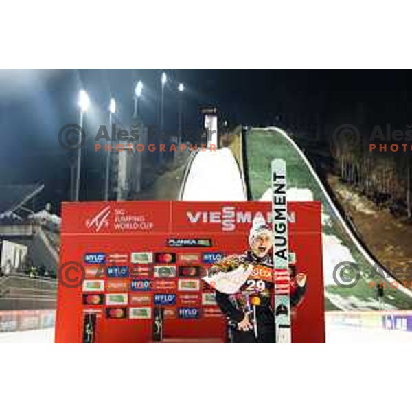 Eva Pinkelnig of Austria in action during trophy ceremony after the final round of FIS Ski Jumping competition in Planica, Slovenia on March 21, 2024