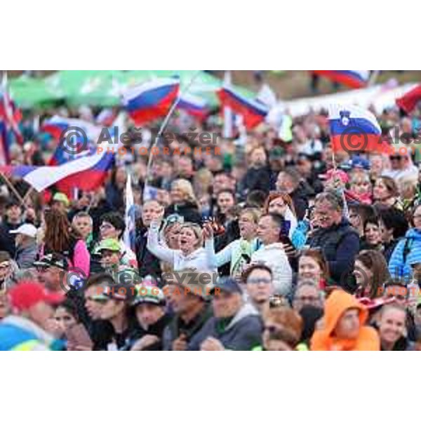 Slovenian fans with flags and banners support ski jumpers at Team Competition during the Final of the World Cup ski jumping in Planica, Slovenia on March 23, 2024