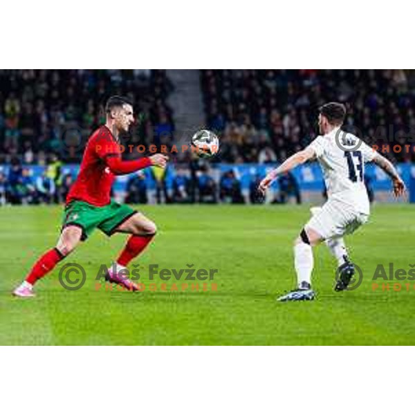 Diogo Dalot of Portugal vs Erik Janza of Slovenia in action during Friendly football match between Slovenia and Portugal in Stadium Stozice, Slovenia on March 26, 2024. Photo: Grega Valancic
