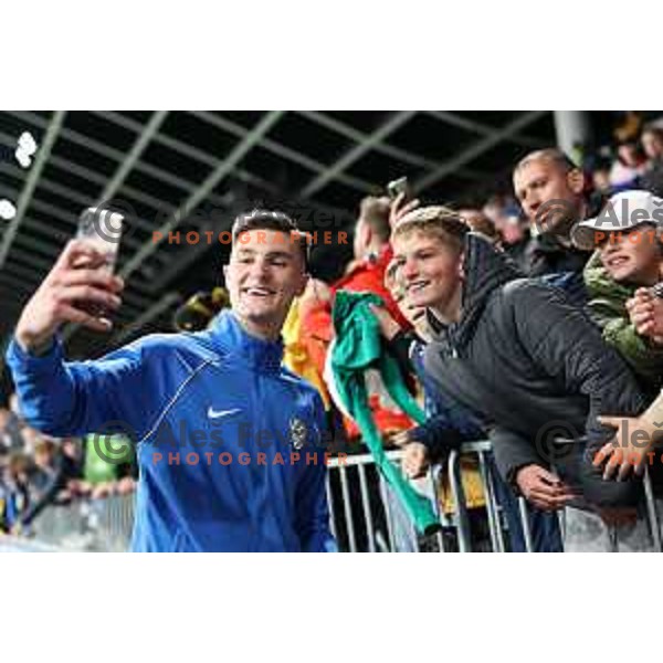 Benjamin Sesko poses for a selfie with his fans after friendly football match between Slovenia and Portugal in Ljubljana, Slovenia on March 26, 2024