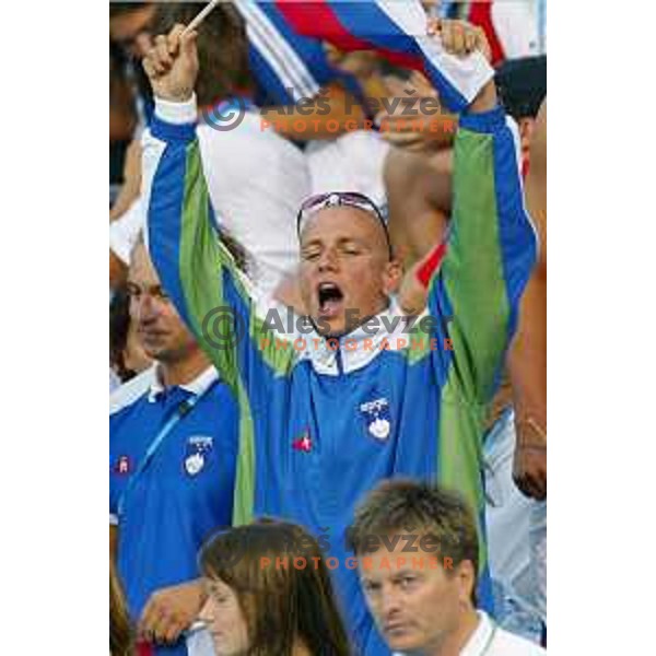 Emil Tahirovic and swimmers of Slovenia cheering at Athens 2004 Summer Olympic games in Athens, Greece on August 18, 2004